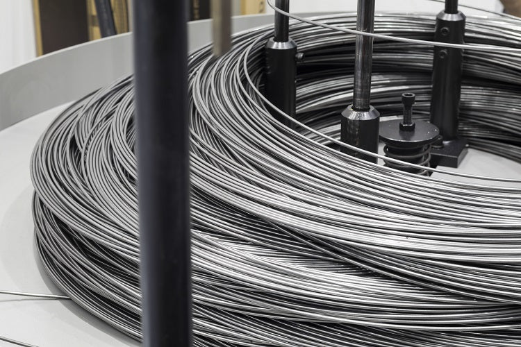 Coiled wire on a reel with a close-up view