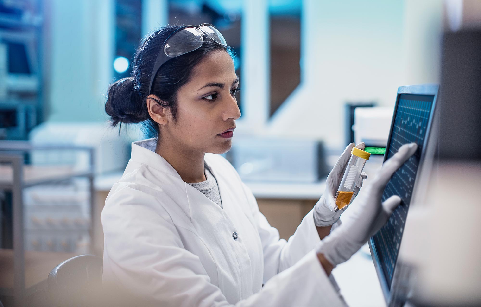 Blachford scientist working with lab equipment and computer in a laboratory setting