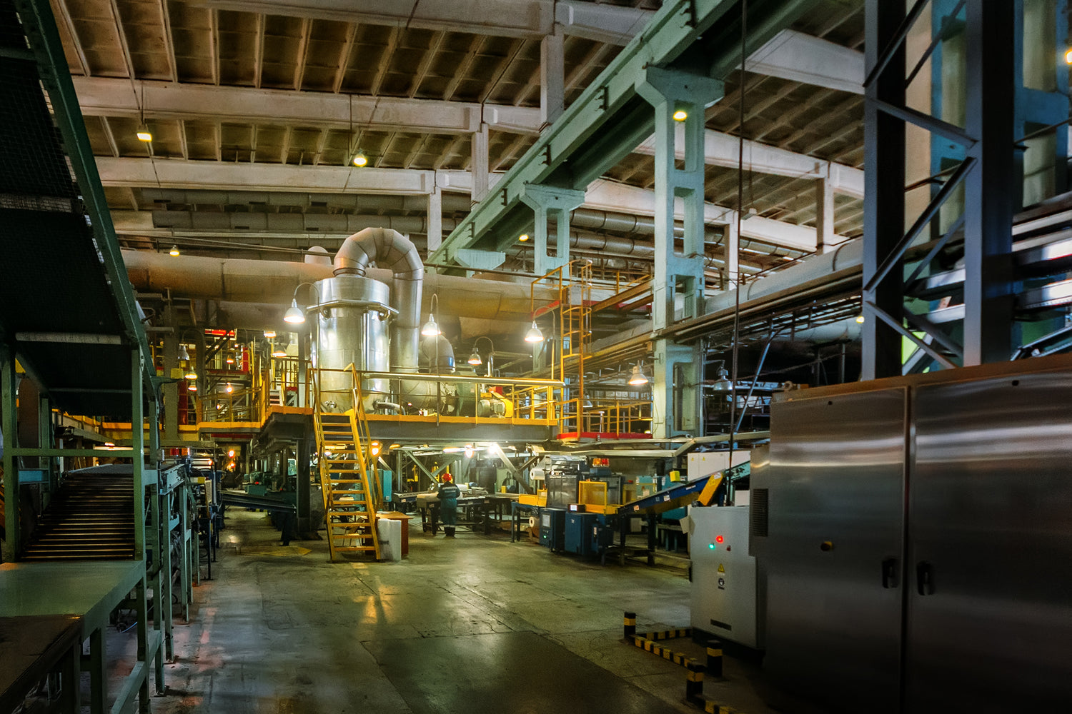 Industrial factory interior with machinery and equipment.