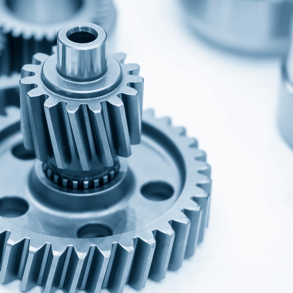 Close-up of metal gears on a white background