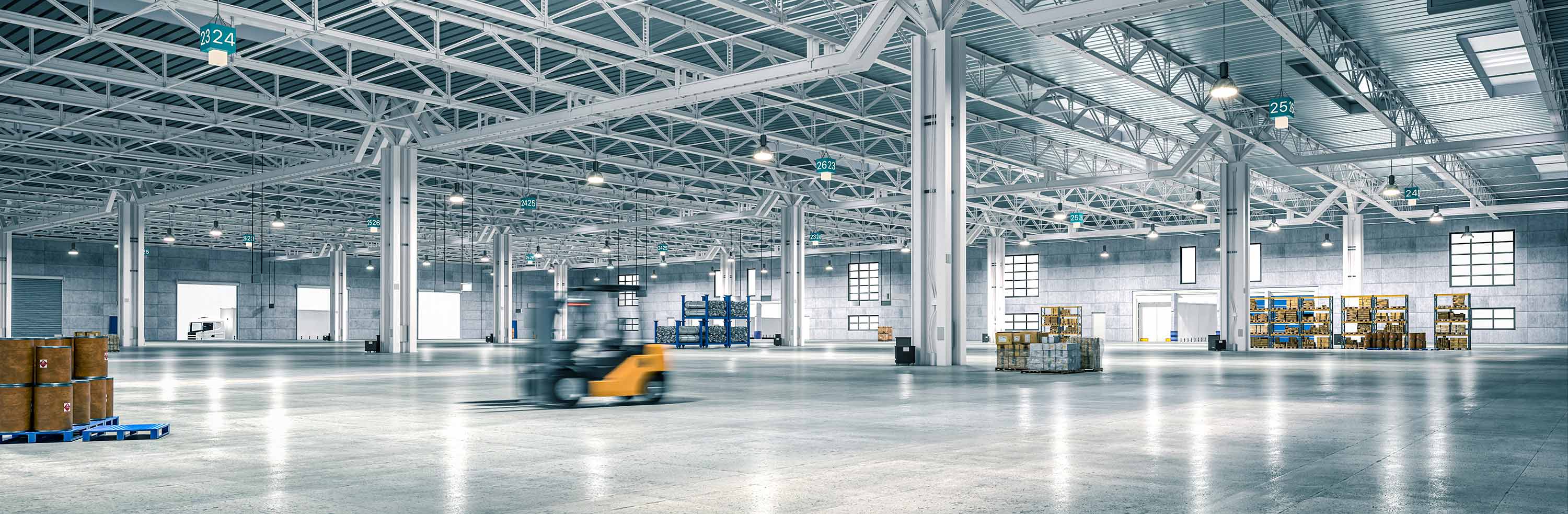 Large warehouse interior with forklift and pallets