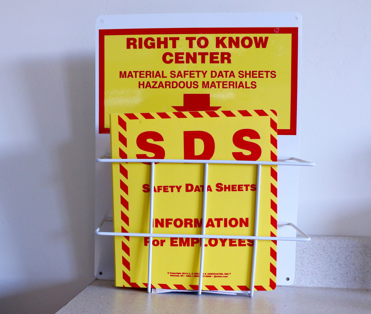 Yellow and red safety data sheets sign with 'Right to Know Center' text on a white background.