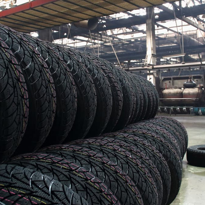 Stack of tires in a warehouse setting