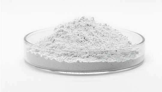 Glass container filled with white powder on a white background